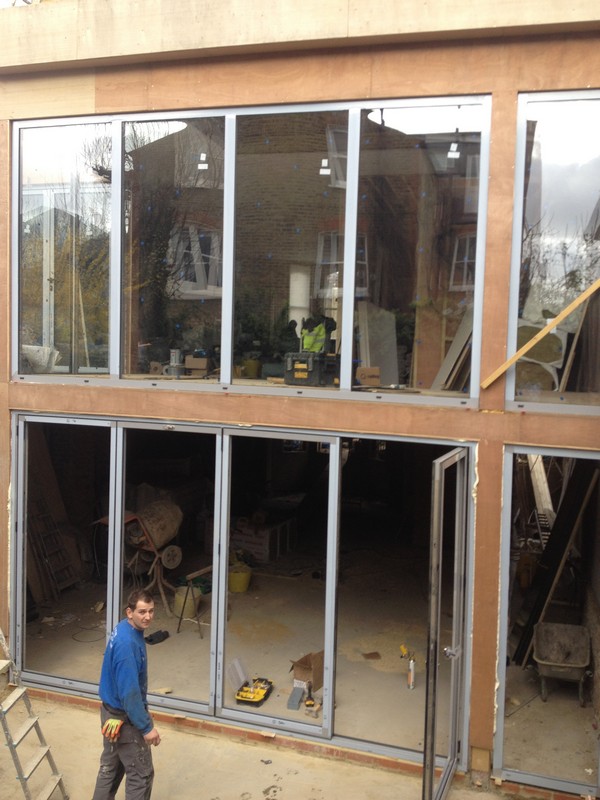 Aluminium bi-fold doors with two-storey glazing in Southgate