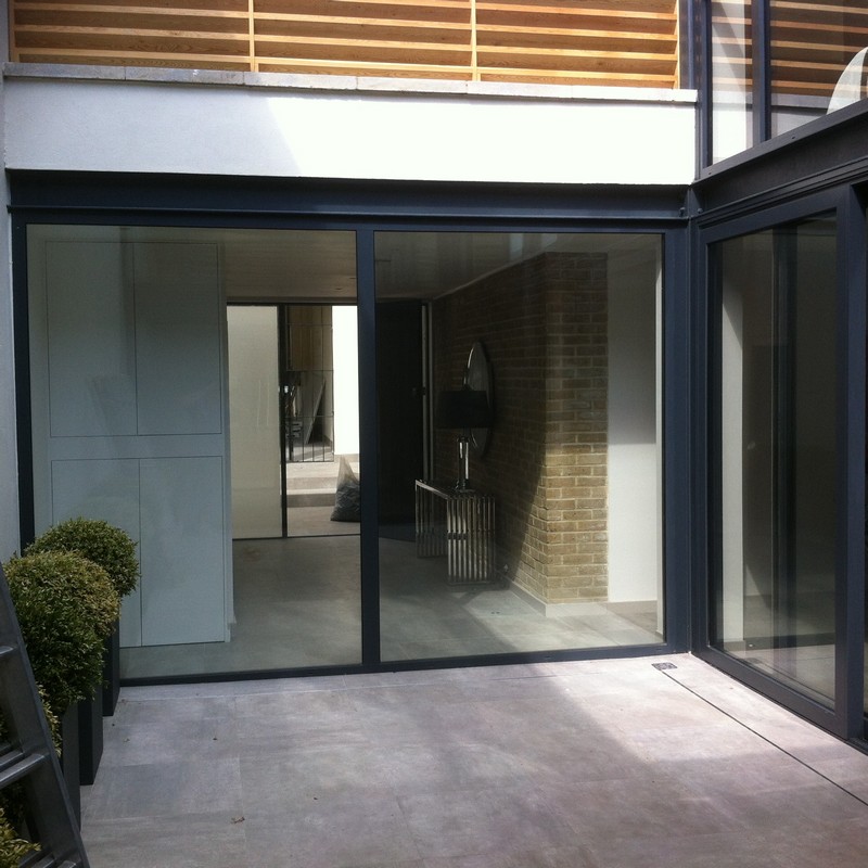 Floor-to-ceiling sliding doors opening to courtyard in Southgate