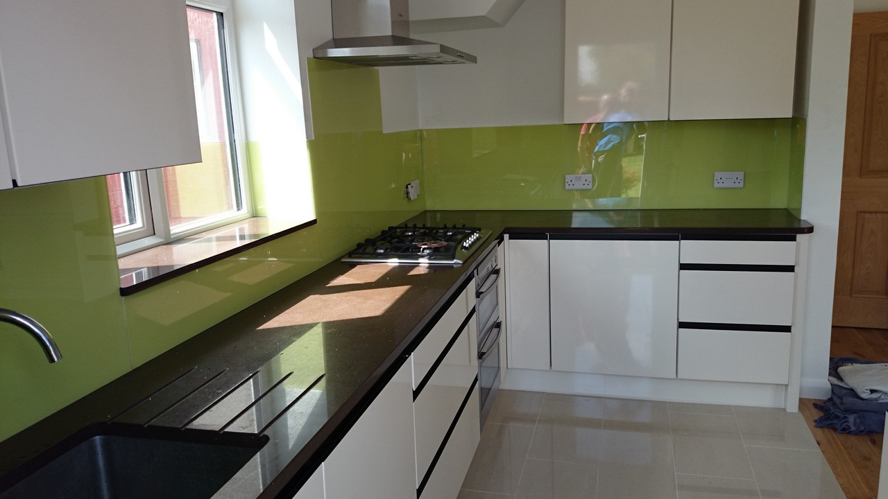 Lime green glass kitchen splashback installed by Southgate glaziers